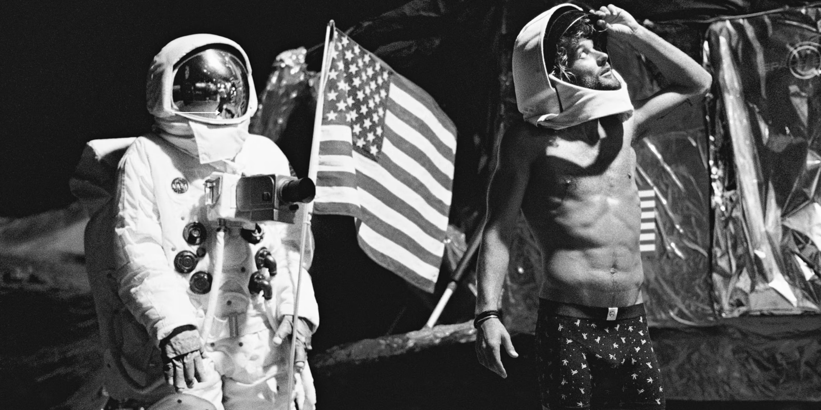 Person in astronaut costume with American flag and another person in casual clothing on a dark background